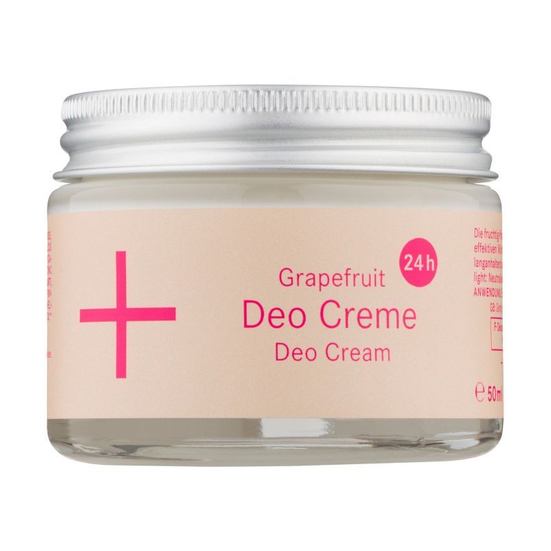 Glasbehälter mit silbernem Deckel. Aufschrift: Grapefruit Deo Creme, 24h. Rosa Pluszeichen links. Inhalt sichtbar.