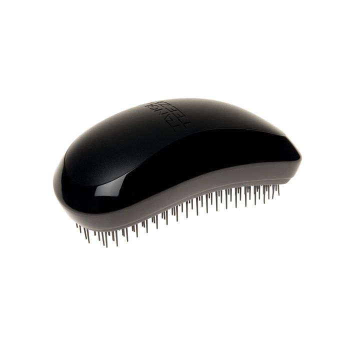 Schwarze Tangle Teezer Haarbürste. Oval, mit schwarzen Borsten. Markenschriftzug auf der Oberseite.