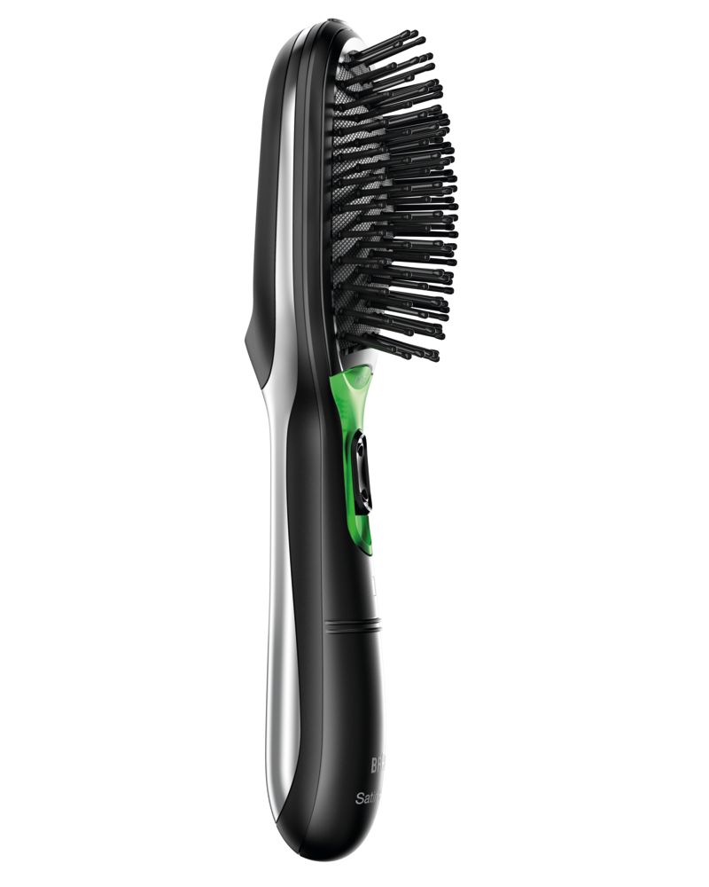 Elektrische Haarbürste mit schwarzen Borsten und schwarzem Griff mit silbernen Akzenten und grünen Bedienelementen.