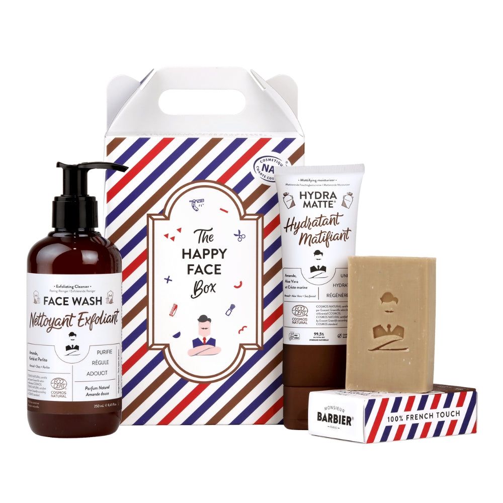 Gesichtspflege-Set 'THE HAPPY FACE BOX' von Monsieur BARBIER. Enthält Gesichtsreiniger, Feuchtigkeitspflege und Seife. Verpackung mit Streifen.