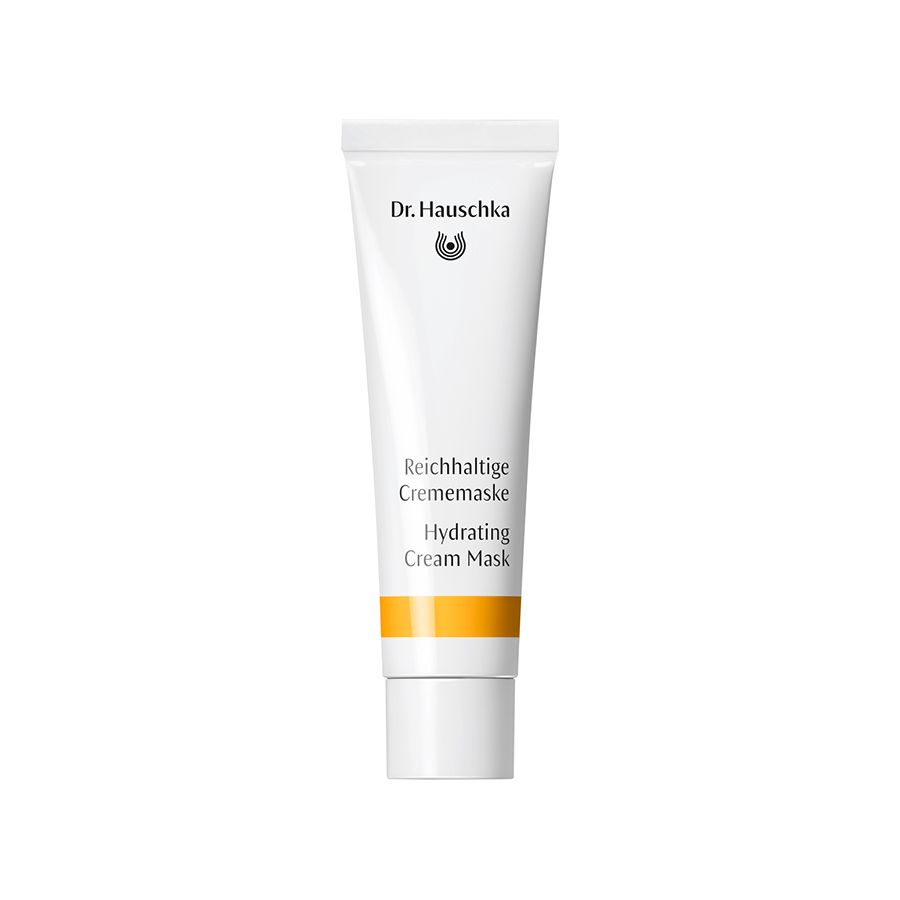 Weiße Tube mit gelbem Streifen. Aufschrift: Dr. Hauschka, Reichhaltige Crememaske, Hydrating Cream Mask.