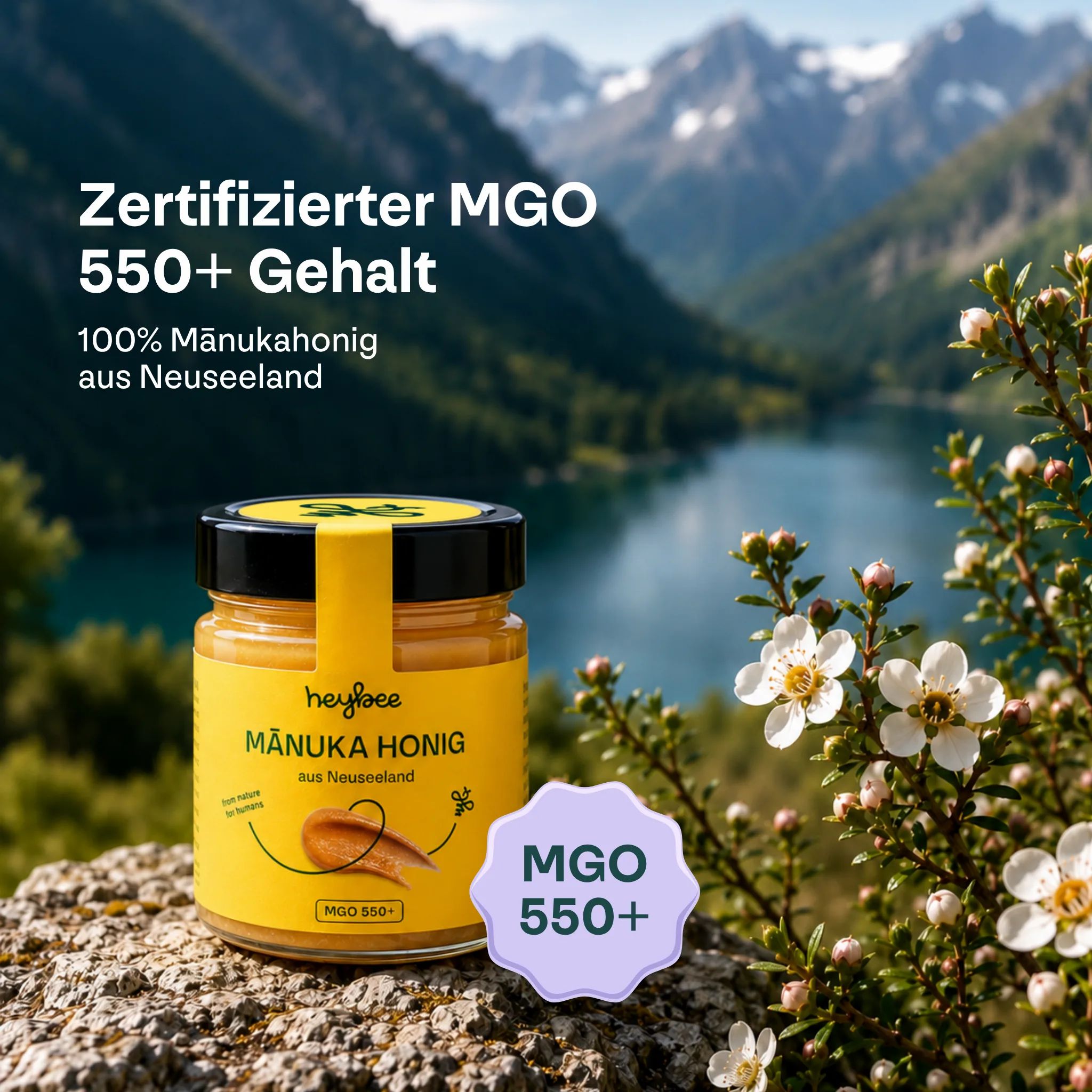 Glas Manuka Honig mit gelbem Etikett, MGO 550+. Bergsee und Blumen im Hintergrund.