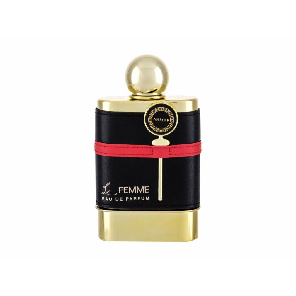 Goldener Flakon mit schwarzem Lederband und rotem Streifen. Aufschrift: Le Femme Eau de Parfum. Goldener Verschluss.