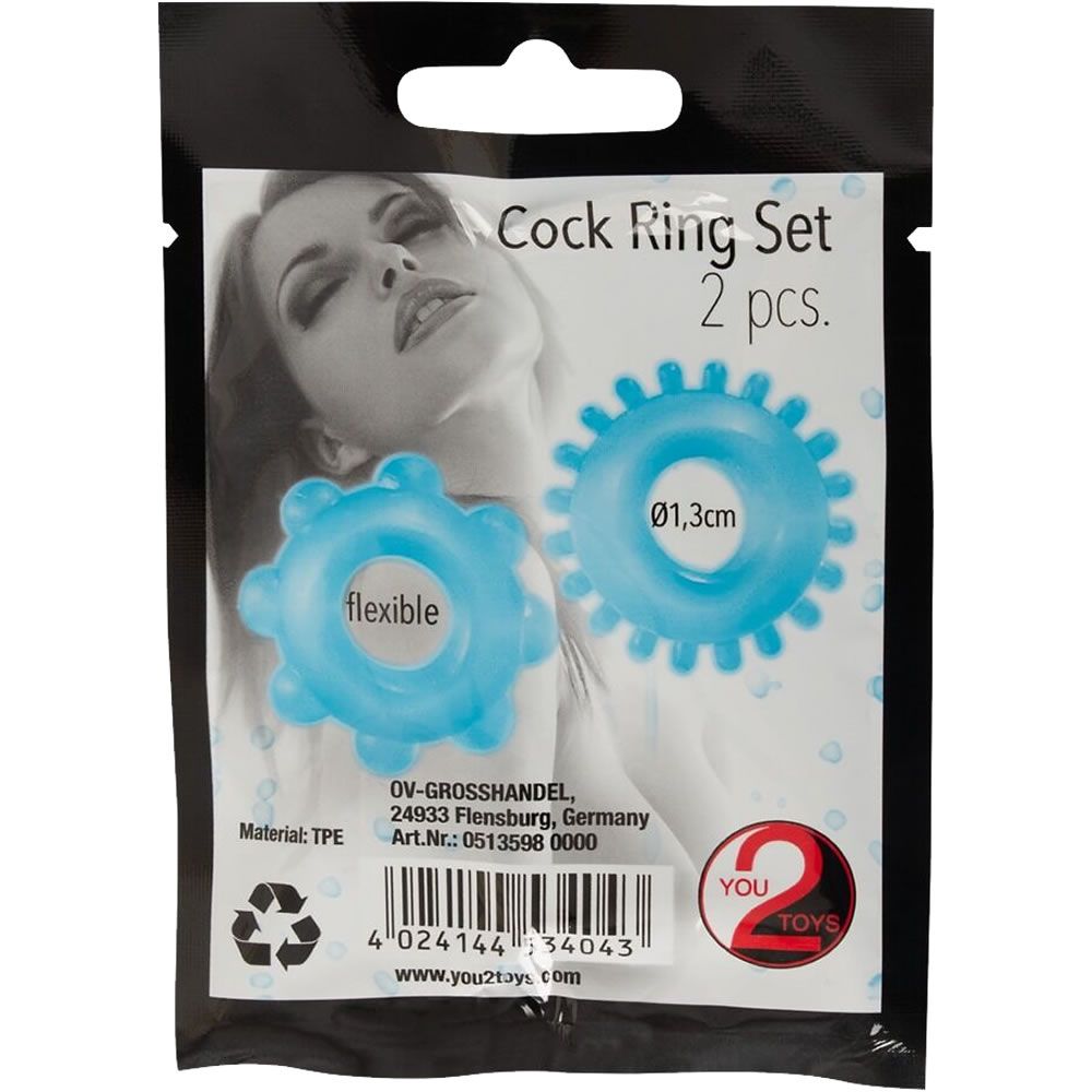Zwei blaue Penisringe in Verpackung. Aufschrift: Cock Ring Set, 2 pcs. Durchmesser 1,3cm. Marke: You2Toys.