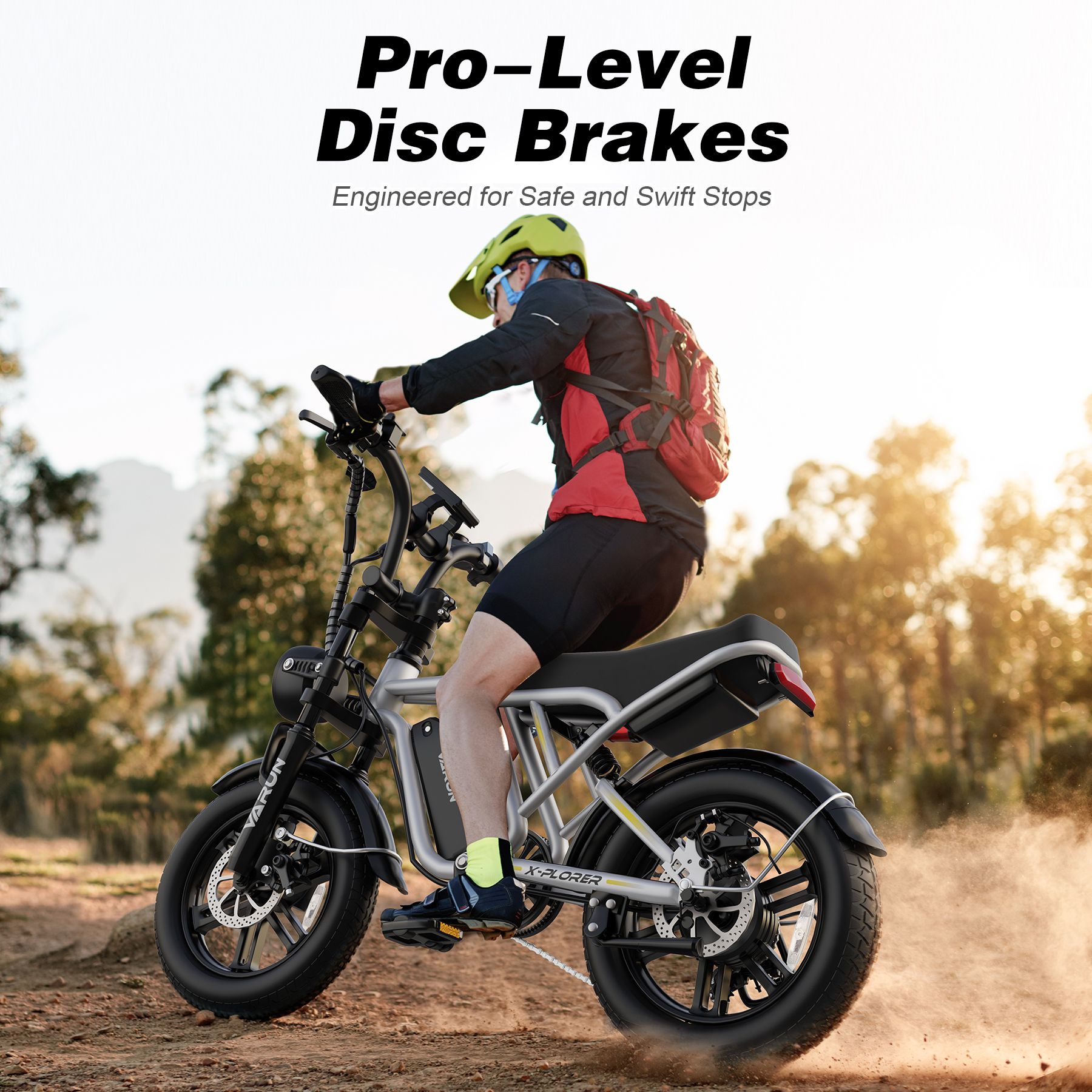 Person fährt E-Bike im Gelände. Helm, Rucksack. Text: Pro-Level Disc Brakes. Engineered for Safe and Swift Stops.