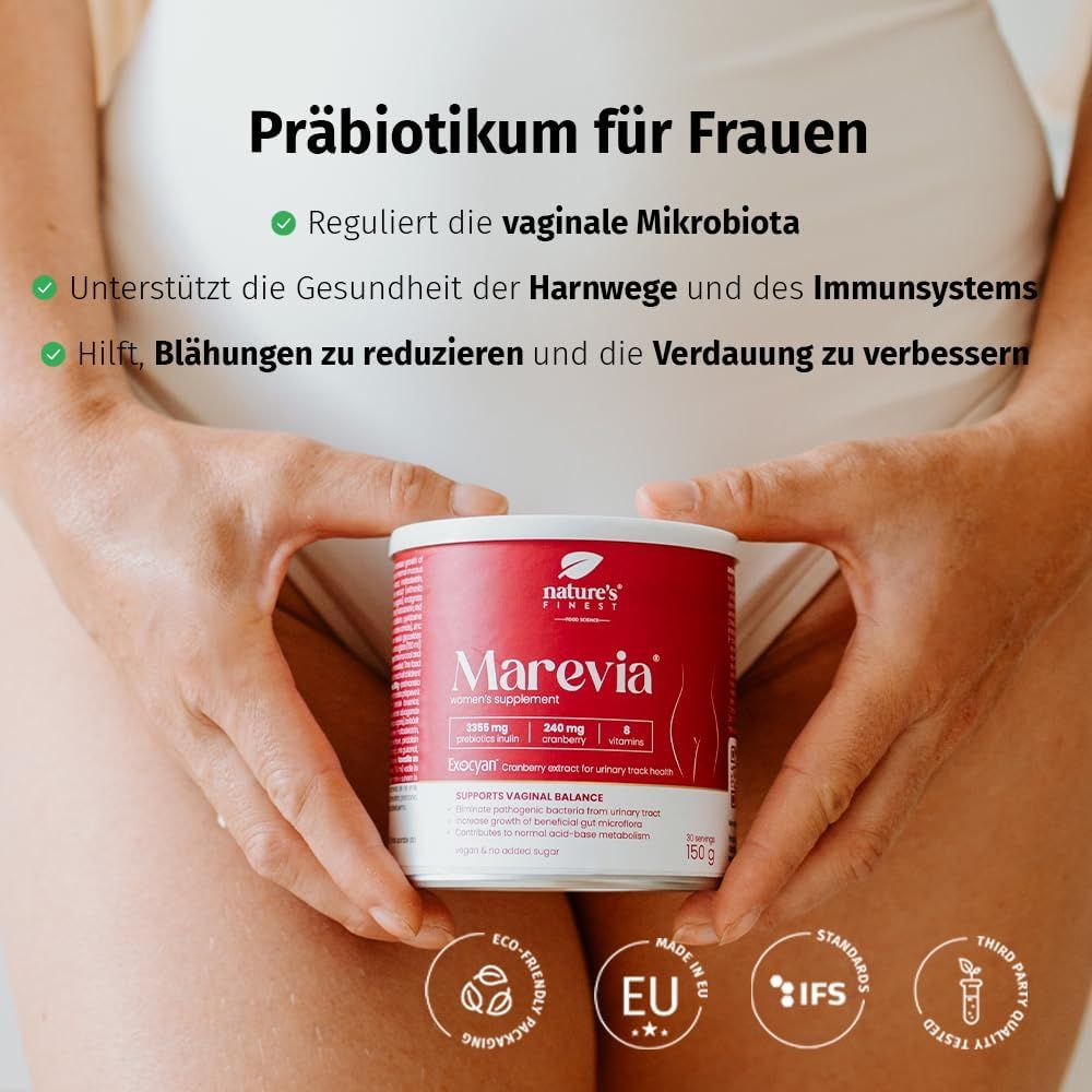Frau hält Dose Nature's Finest Marevia. Dose rosa, Text: Präbiotikum für Frauen. Aufschrift: Reguliert vaginale Mikrobiota, unterstützt Harnwege und Immunsystem, reduziert Blähungen.