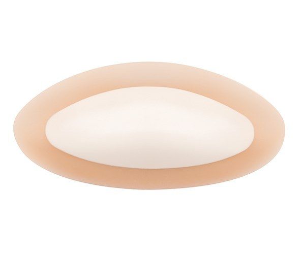 Ovale Brustprothese mit hellem Kern. Hautfarbener Rand. Form: Ellipse.