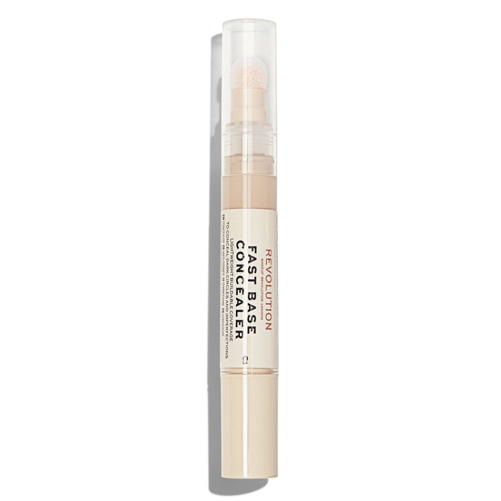 Makeup Revolution Fast Base Concealer. Beige Tube mit transparentem Deckel. Produktname und Marke auf dem Tube.