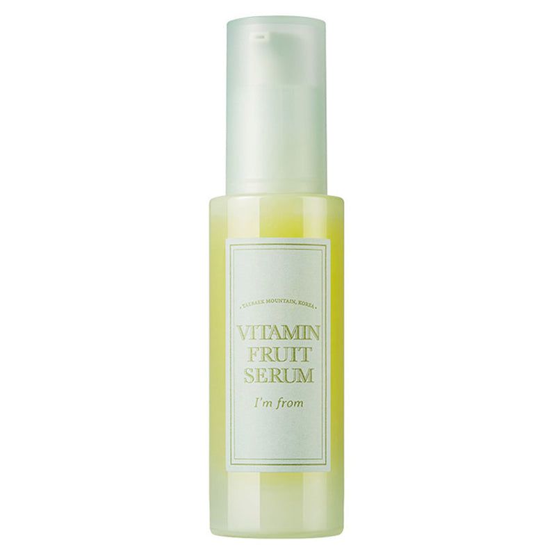 Serumflasche mit Etikett. Aufschrift: Vitamin Fruit Serum, I'm from. Gelbe Flüssigkeit sichtbar.