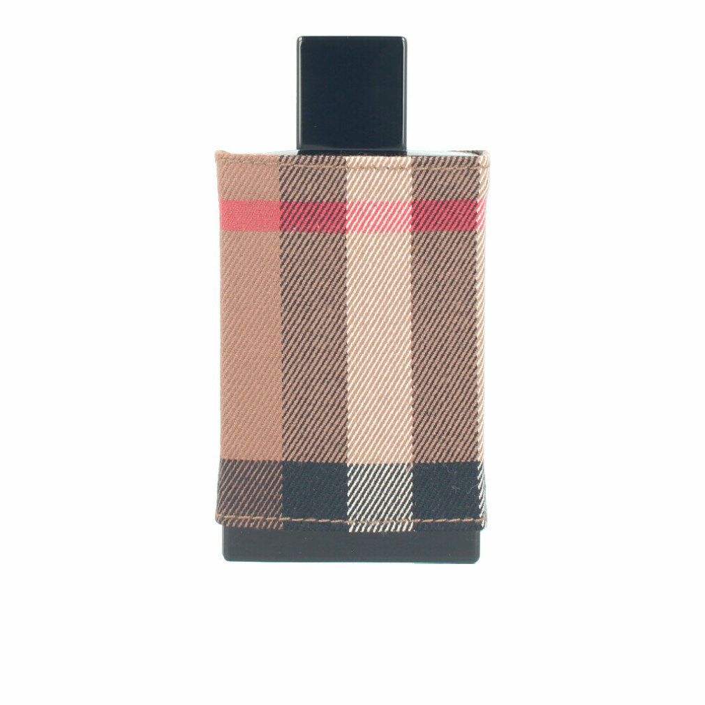 Parfümflakon mit quadratischem Deckel und Burberry-Karomuster-Hülle. Schwarzer Boden. Beige, rote und schwarze Karos.