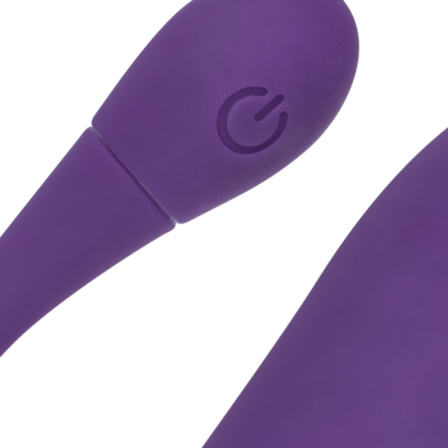 Nahaufnahme eines lila Wellness-Produkts. Sichtbar: Ein Power-Knopf.