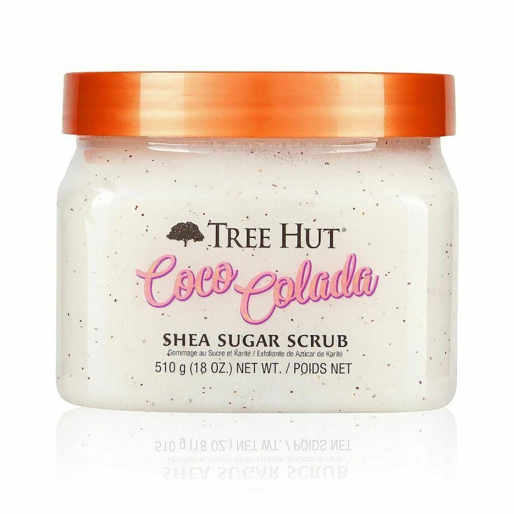Tree Hut Coco Colada Shea Sugar Scrub in einem durchsichtigen Behälter mit orangefarbenem Deckel.
