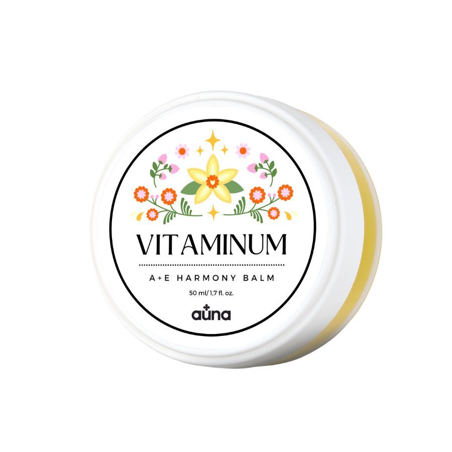 Runder, weißer Tiegel mit floralem Design und Aufschrift "Vitaminum A+E Harmony Balm". Marke: auna.