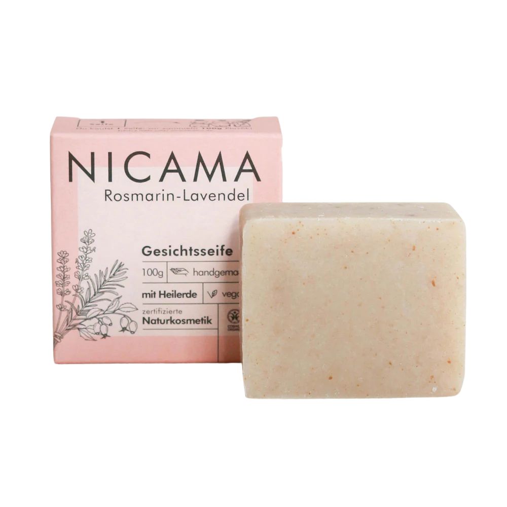 Gesichtsseife und Verpackung. Rosa Verpackung mit Text: NICAMA, Rosmarin-Lavendel, Gesichtsseife. Naturkosmetik.