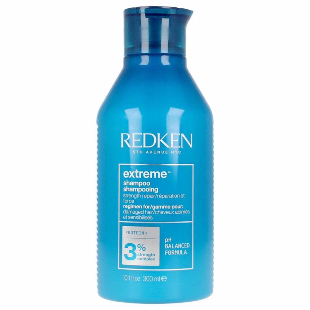 Blaue Shampoo-Flasche. Aufschrift: REDKEN, extreme shampoo, 3% strength complex, pH balanced formula. 300ml.