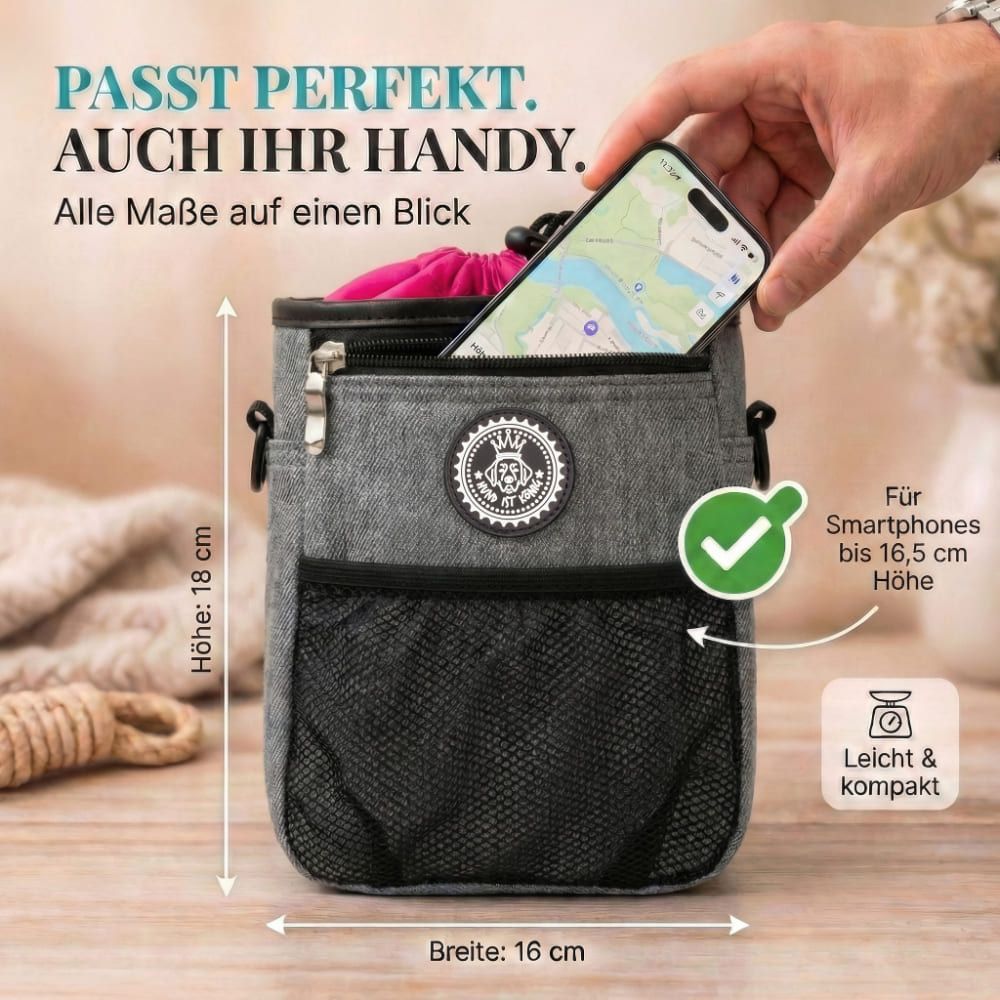 Grauer Futterbeutel mit pinkem Innenfutter. Smartphone in der Tasche. Maße: 18 cm hoch, 16 cm breit. Für Smartphones bis 16,5 cm.