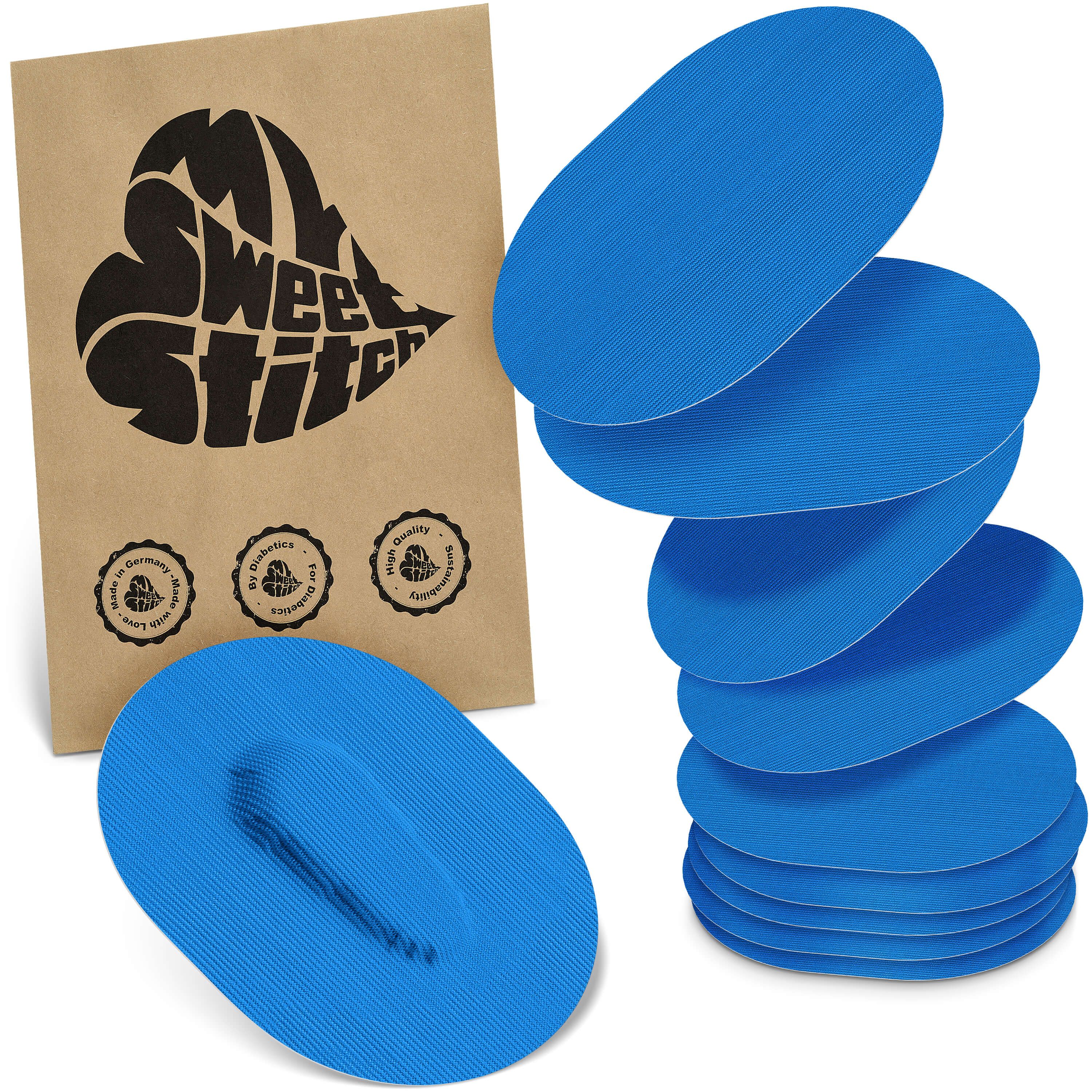 Blaue, ovale Pflaster. Auf brauner Verpackung steht "MySweetStitch". Mehrere Pflaster sind gestapelt. Verpackung mit Logo und Qualitätssiegeln.