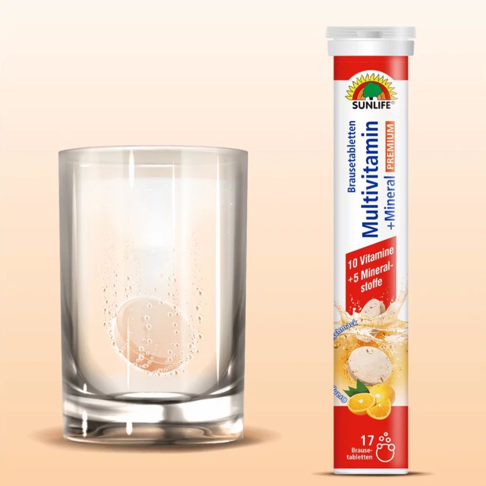 Brausetablette löst sich in einem Glas Wasser auf. Daneben eine Tube mit roter und weißer Beschriftung.