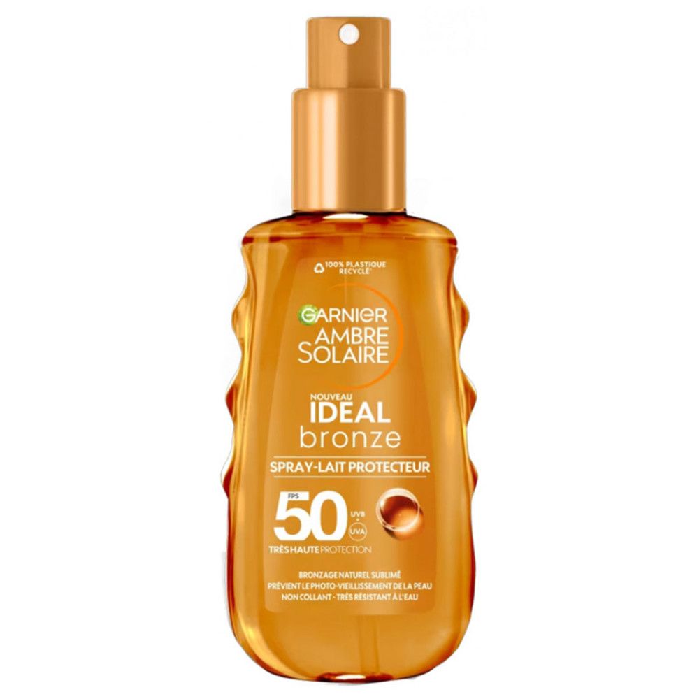 Bräunungsspray mit SPF50. Flasche mit Sprühkopf. Garnier Ambre Solaire Ideal Bronze. Hoher Sonnenschutz. Braune Flüssigkeit.