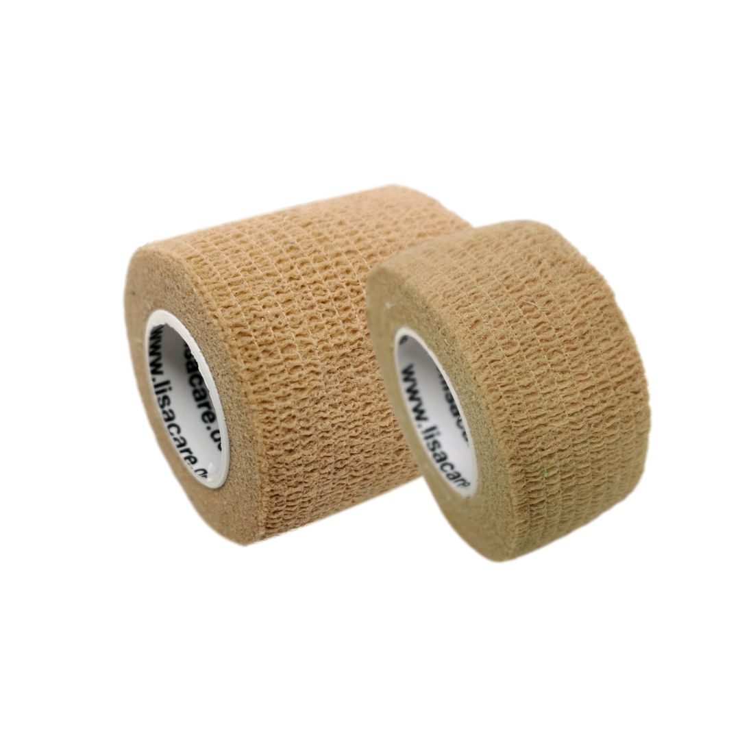 Zwei Rollen selbstklebender Verband in Beige, eine größer als die andere.
