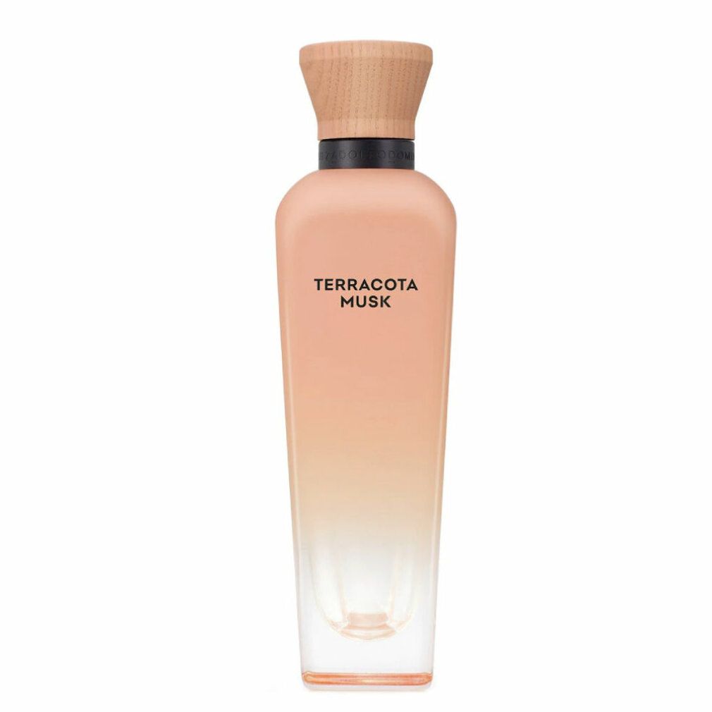Parfümflasche mit Holzverschluss, rosa Farbverlauf. Produktname in schwarzer Schrift. Transparenter Glasboden.
