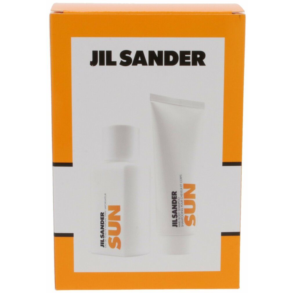 Set mit Eau de Toilette und Duschgel in orangefarbener Verpackung. Weiße Flakons mit orangefarbener Schrift. Schriftzug auf der Verpackung.