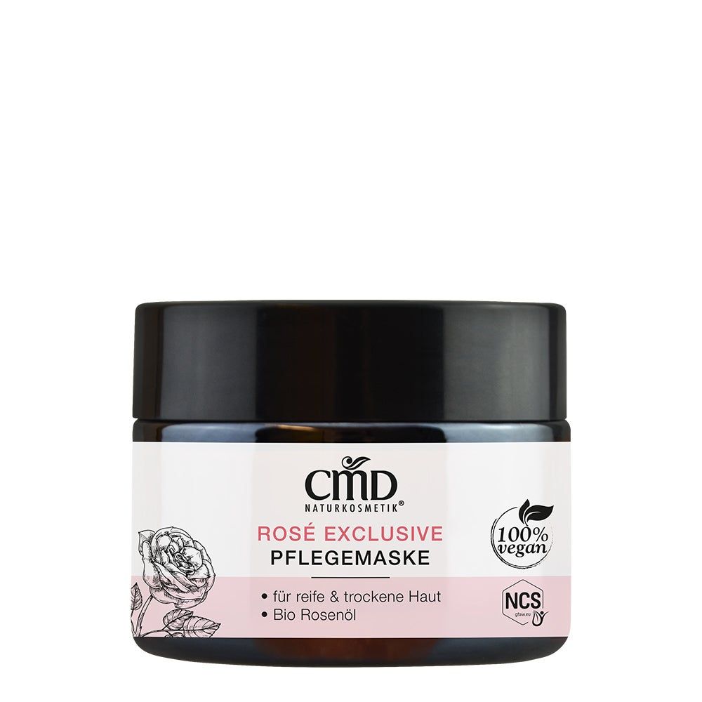 Tiegel mit schwarzem Deckel und weißem Etikett. Aufschrift: CMD Naturkosmetik, Rosé Exclusive Pflegemaske. 100% vegan. Für reife & trockene Haut.