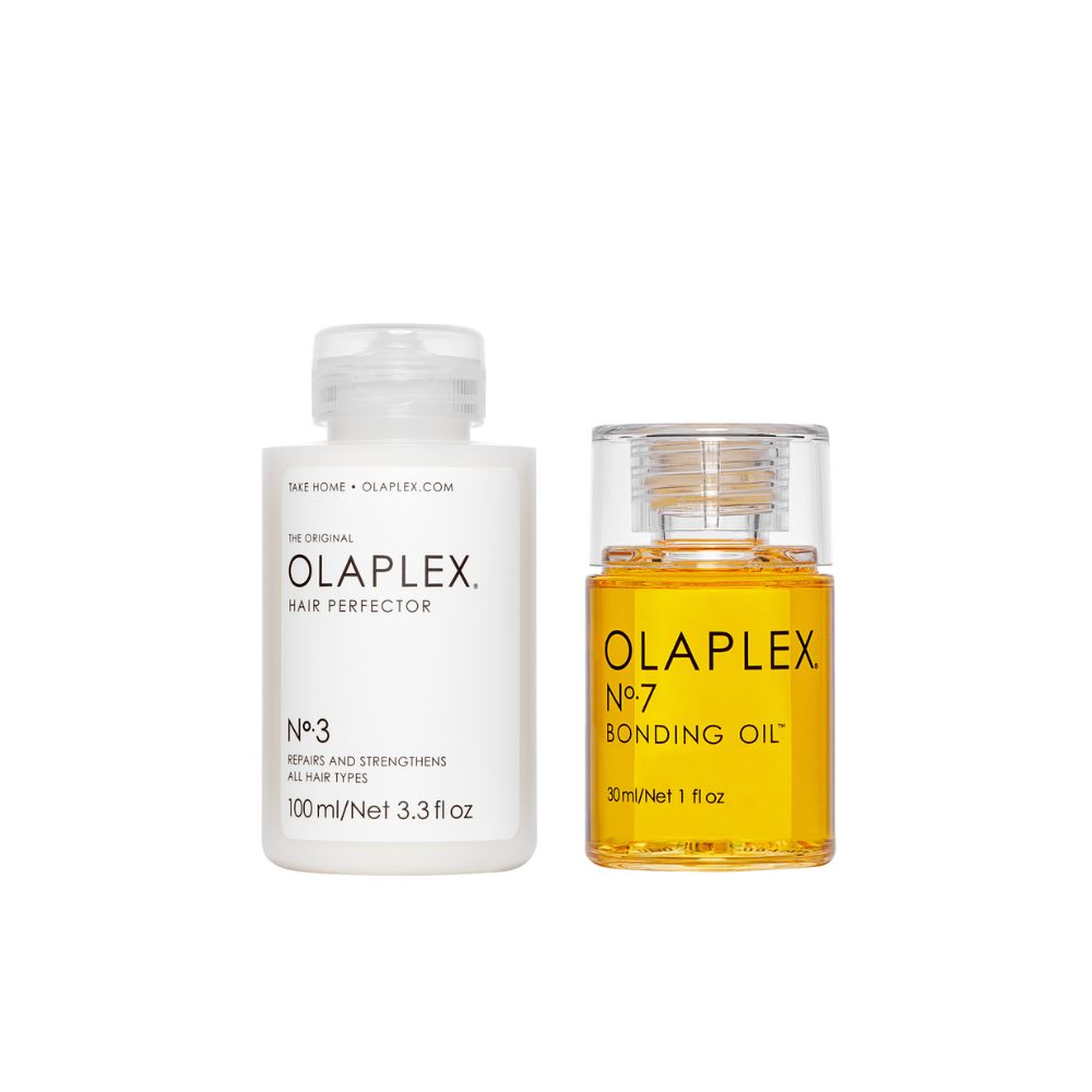 Zwei Flaschen. Eine weiße Flasche mit "OLAPLEX Hair Perfector No.3". Eine gelbe Flasche mit "OLAPLEX No.7 Bonding Oil".