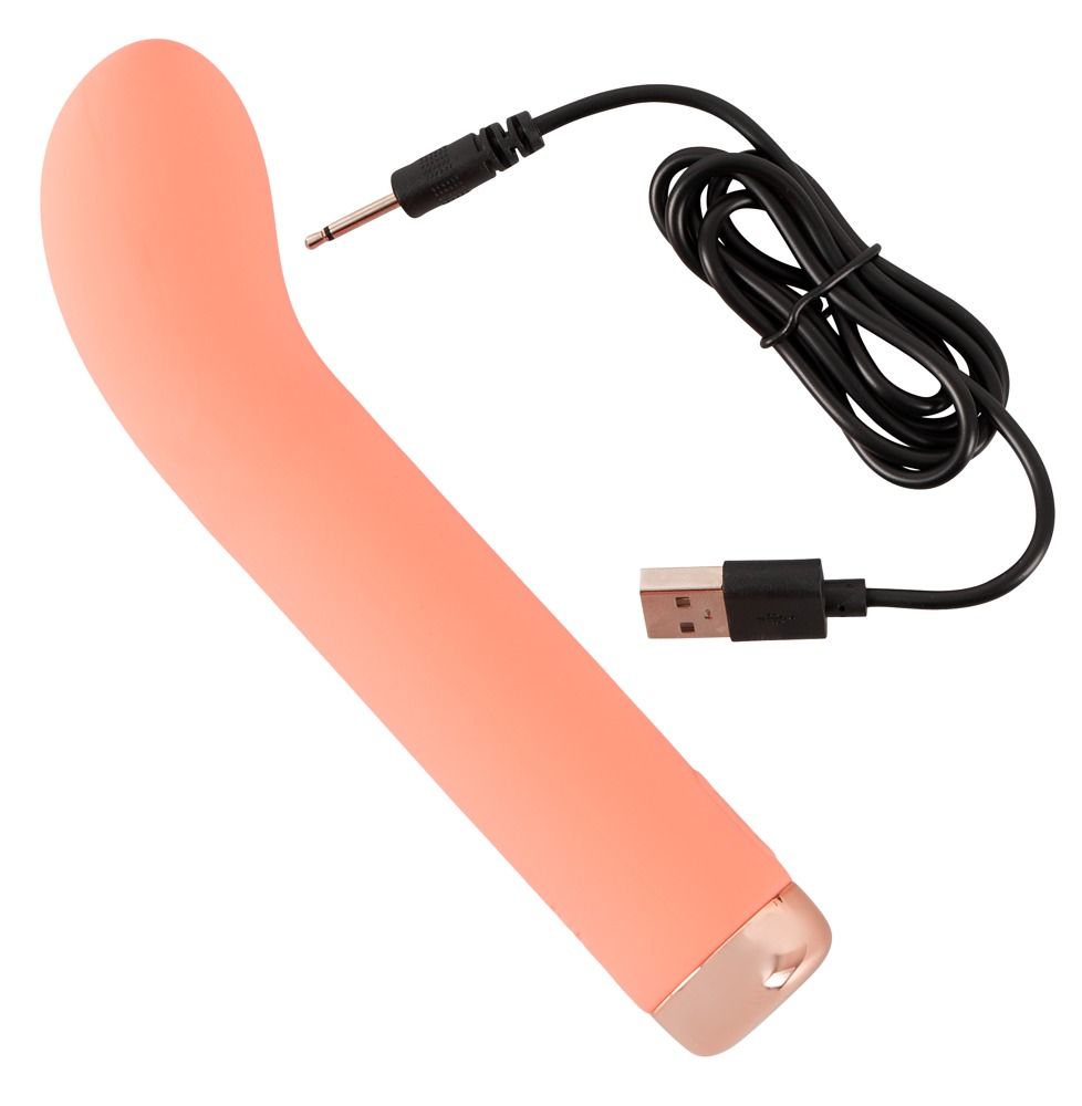 Korallenfarbener Vibrator mit Ladekabel. USB- und Klinkenstecker.