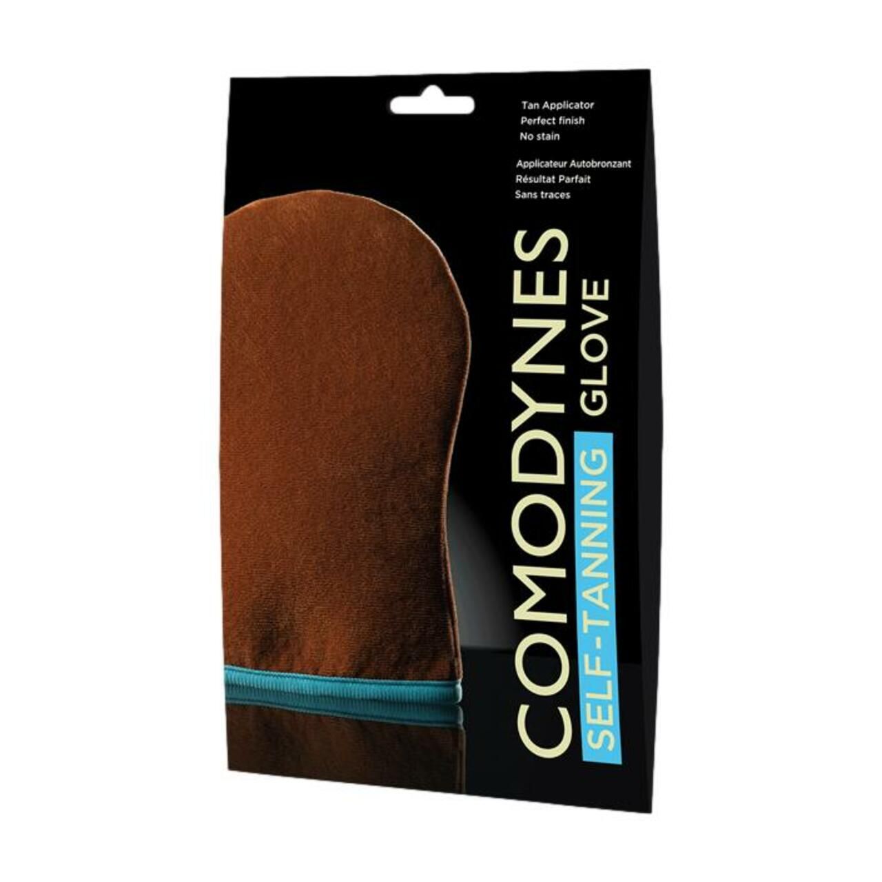 Verpackung mit braunem Selbstbräuner-Handschuh. Text: "COMODYNES SELF-TANNING GLOVE".