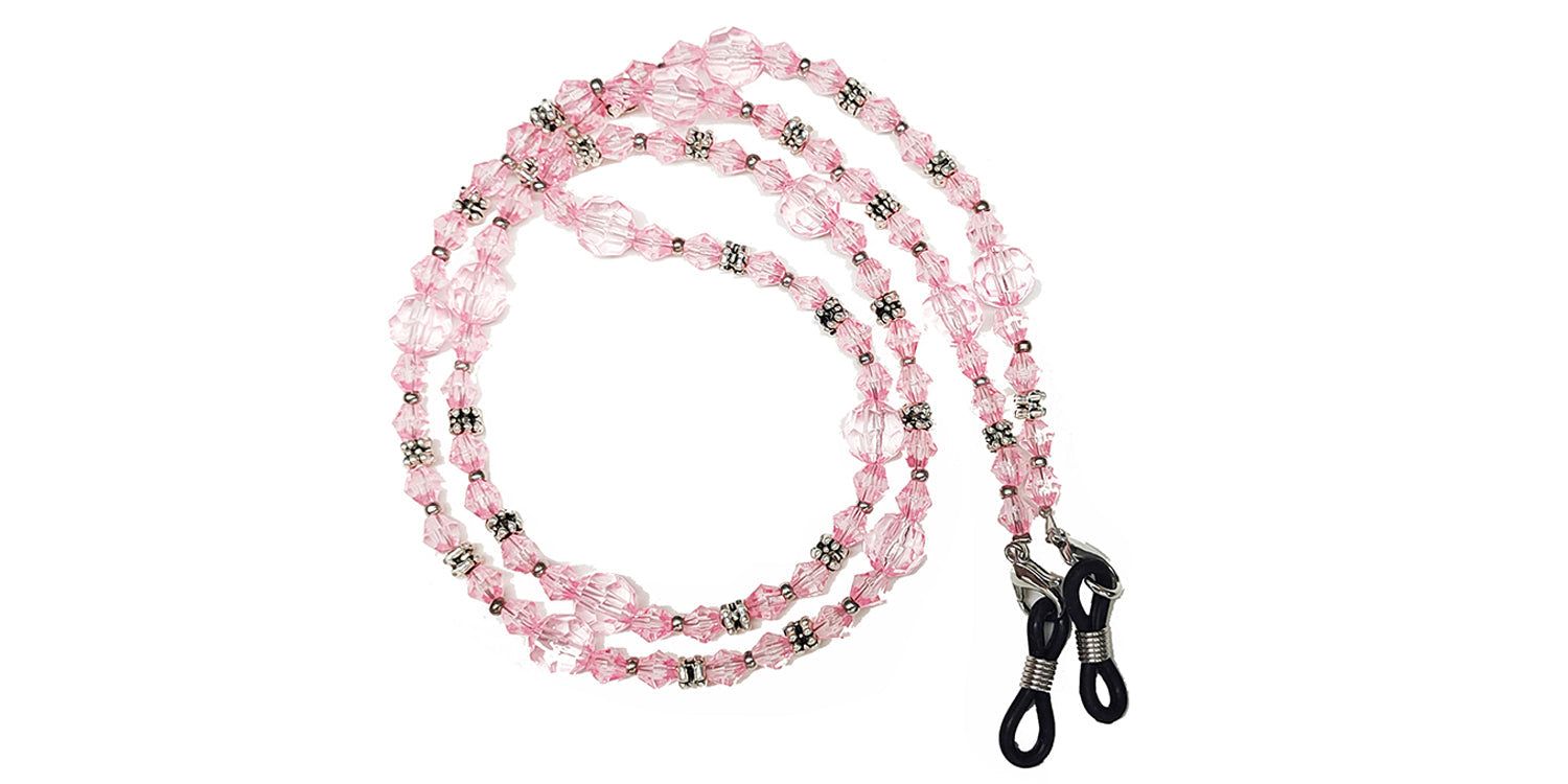 Brillenkette mit rosa Perlen und Metallakzenten. Enden mit Schlaufen zur Befestigung an Brillenbügeln.