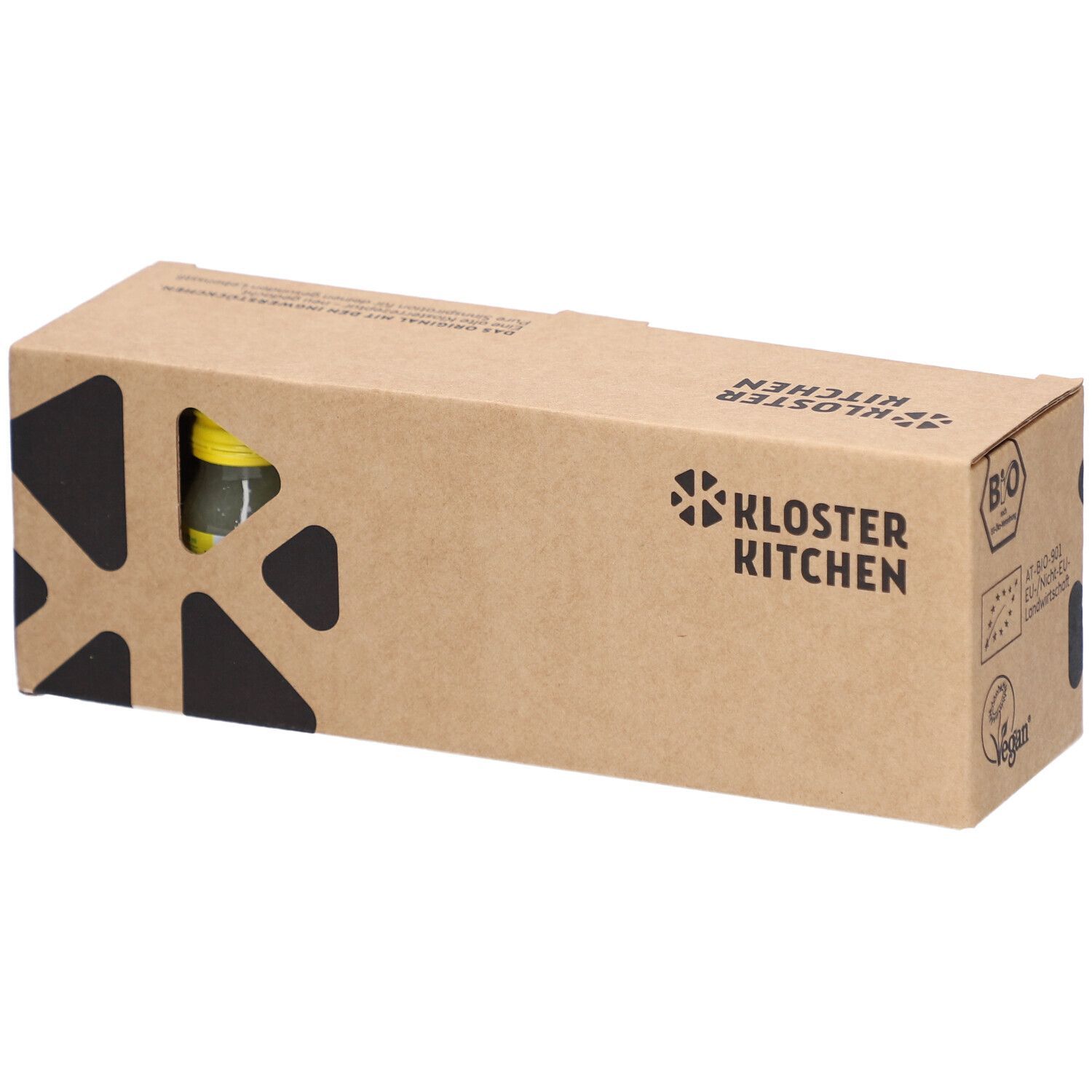 Braune Kartonverpackung mit dem Logo von Kloster Kitchen. Eine Flasche Ingwer Shot Classic ist in der Verpackung sichtbar.