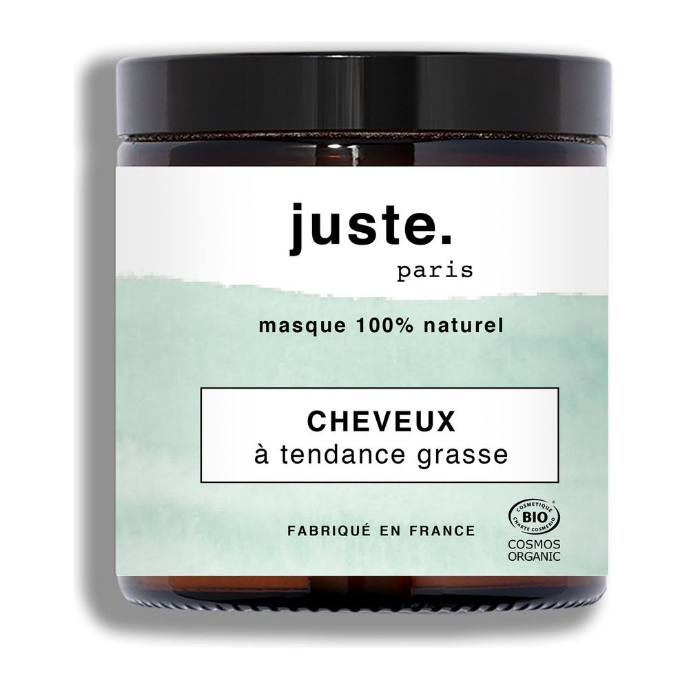Ein Glasbehälter mit der Aufschrift 'juste. paris', 'masque 100% naturel', 'CHEVEUX à tendance grasse'.