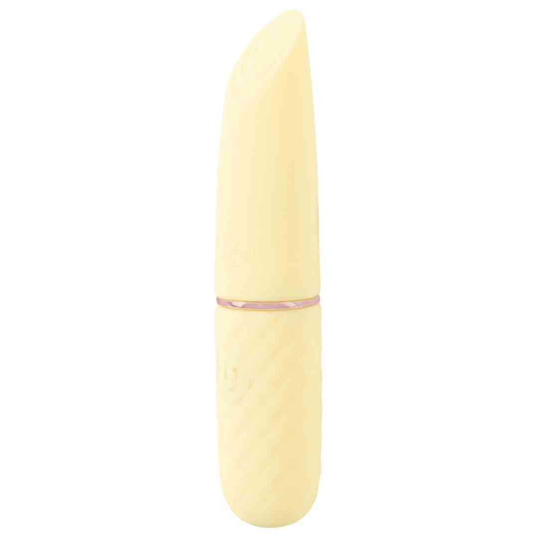 Gelber Vibrator mit abgeschrägter Spitze und strukturiertem Griff. Goldfarbener Ring.