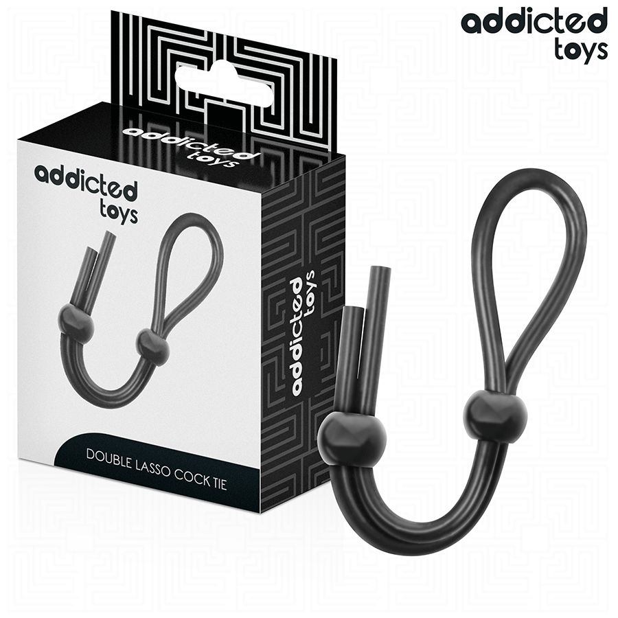 Schwarze Doppelschleife aus Silikon. Produktverpackung mit Markenlogo. Text: DOUBLE LASSO COCK TIE.