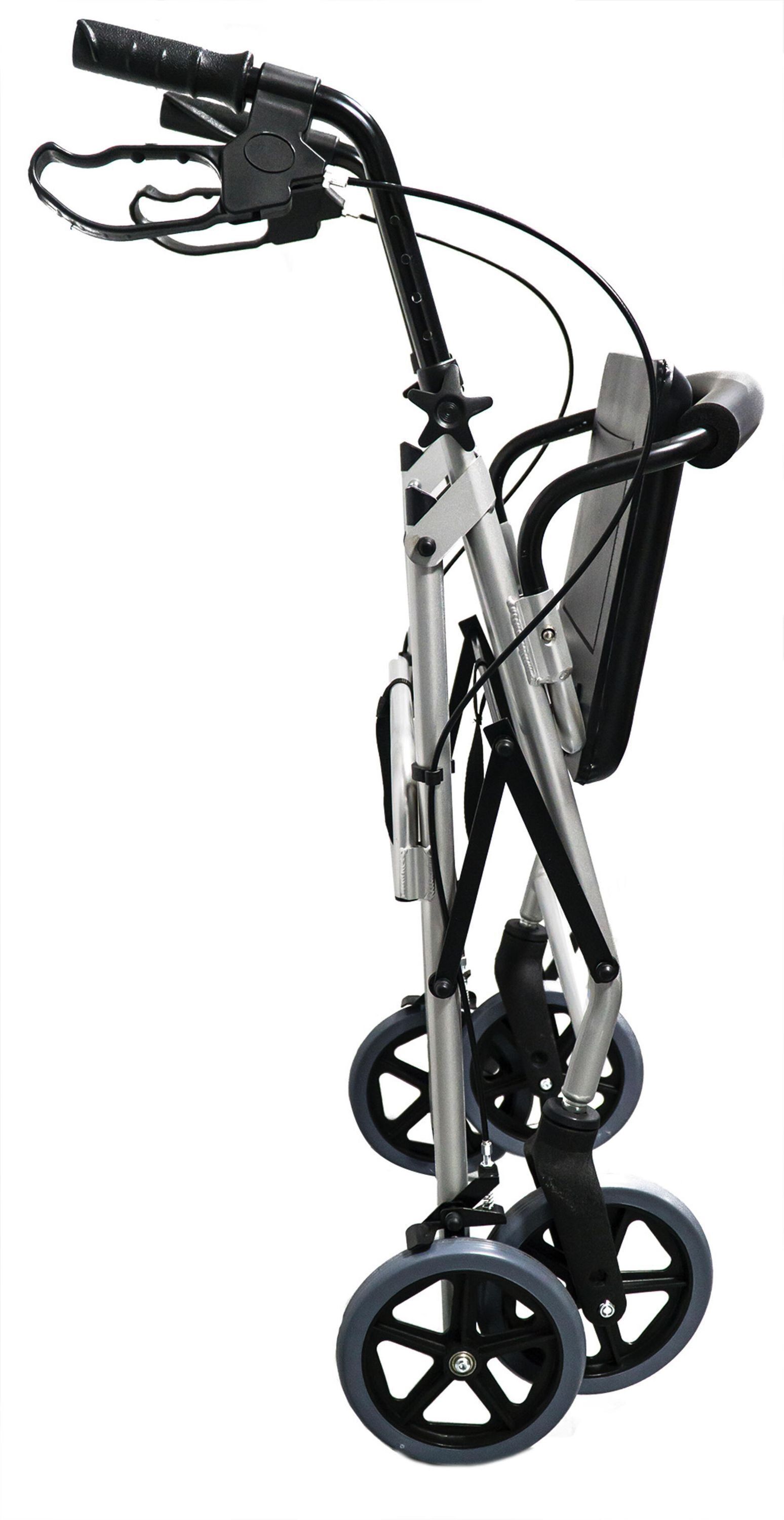 Rollator, silberfarben, zusammengeklappt. Vier Räder, schwarze Griffe und Sitz. Seitliche Ansicht.