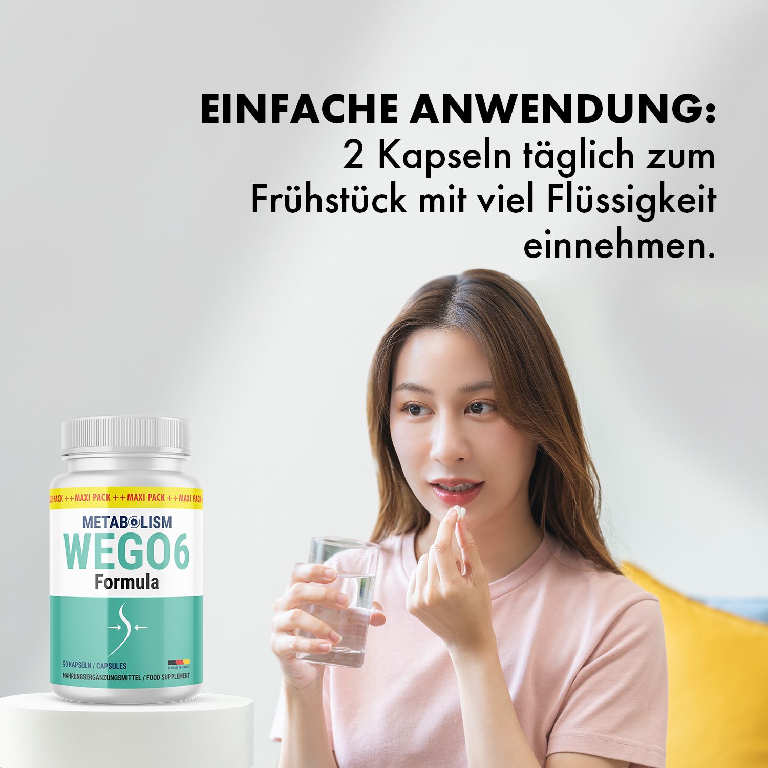 Frau nimmt eine Kapsel aus einem weißen Pillenbehälter. Aufschrift: METABOLISM WEGO6 Formula. Glas Wasser daneben.