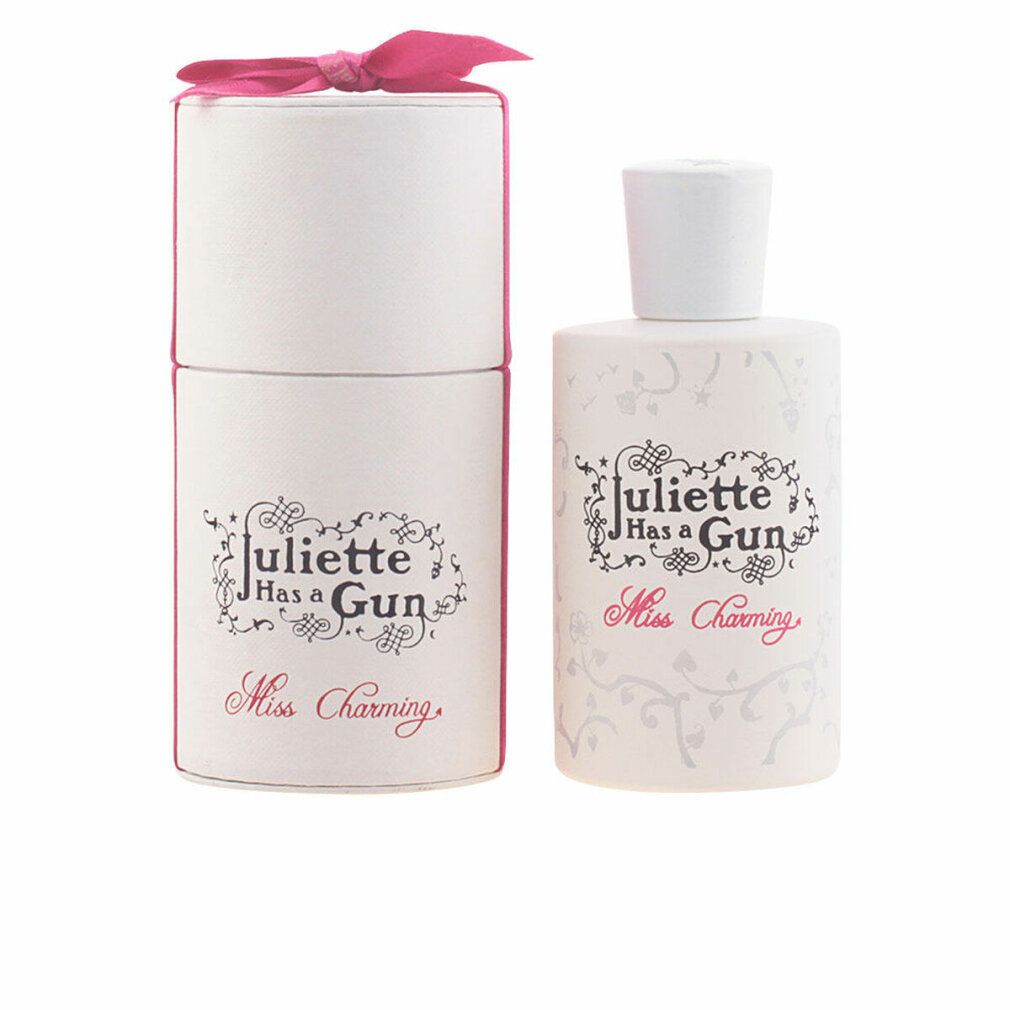Weißes Parfümflakon und zylindrische Schachtel mit Schleife. Aufschrift: Juliette has a gun, Miss Charming.