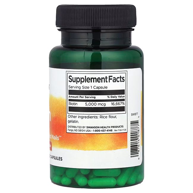 Grüne Kapseln in einer grünen Flasche. Aufschrift: SWANSON. Nährwertangaben: Biotin 5.000 mcg. Zutaten: Reismehl, Gelatine.