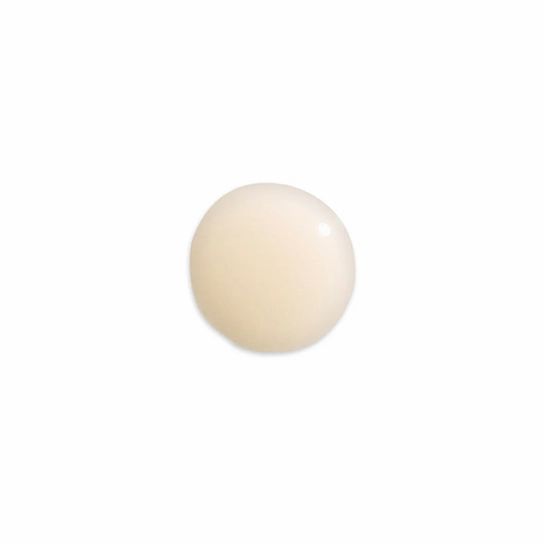 Beige Serum-Tropfen auf weißem Hintergrund. Runde Form, glänzende Oberfläche.