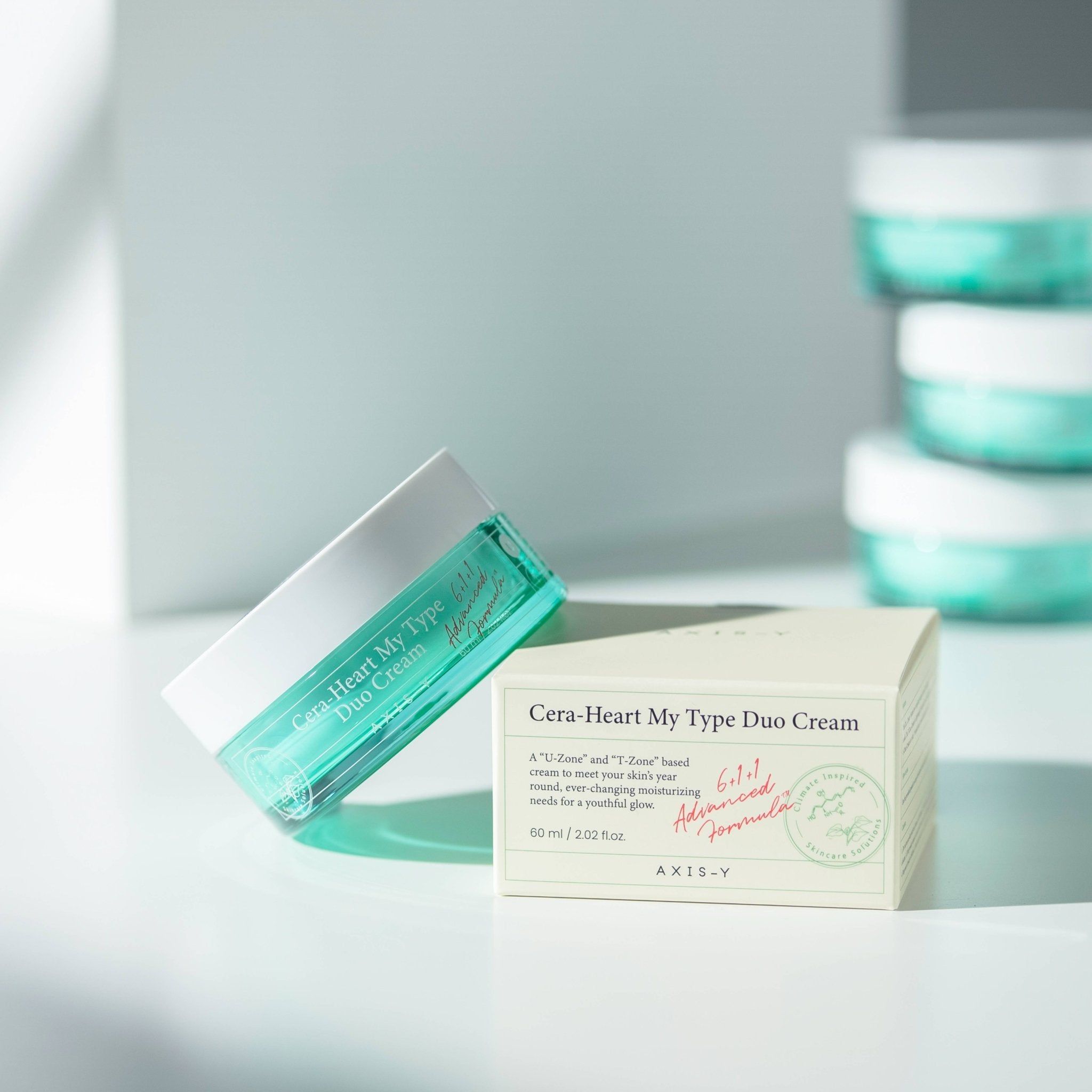 Creme-Dose und Karton. Dose: Cera-Heart My Type Duo Cream. Karton: Cera-Heart My Type Duo Cream, 60 ml, AXIS-Y.