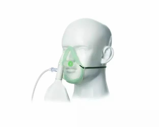 Sauerstoffmaske für Erwachsene mit Schlauch und Reservoir, transparent mit grünem Gurt und Anschlussstück.