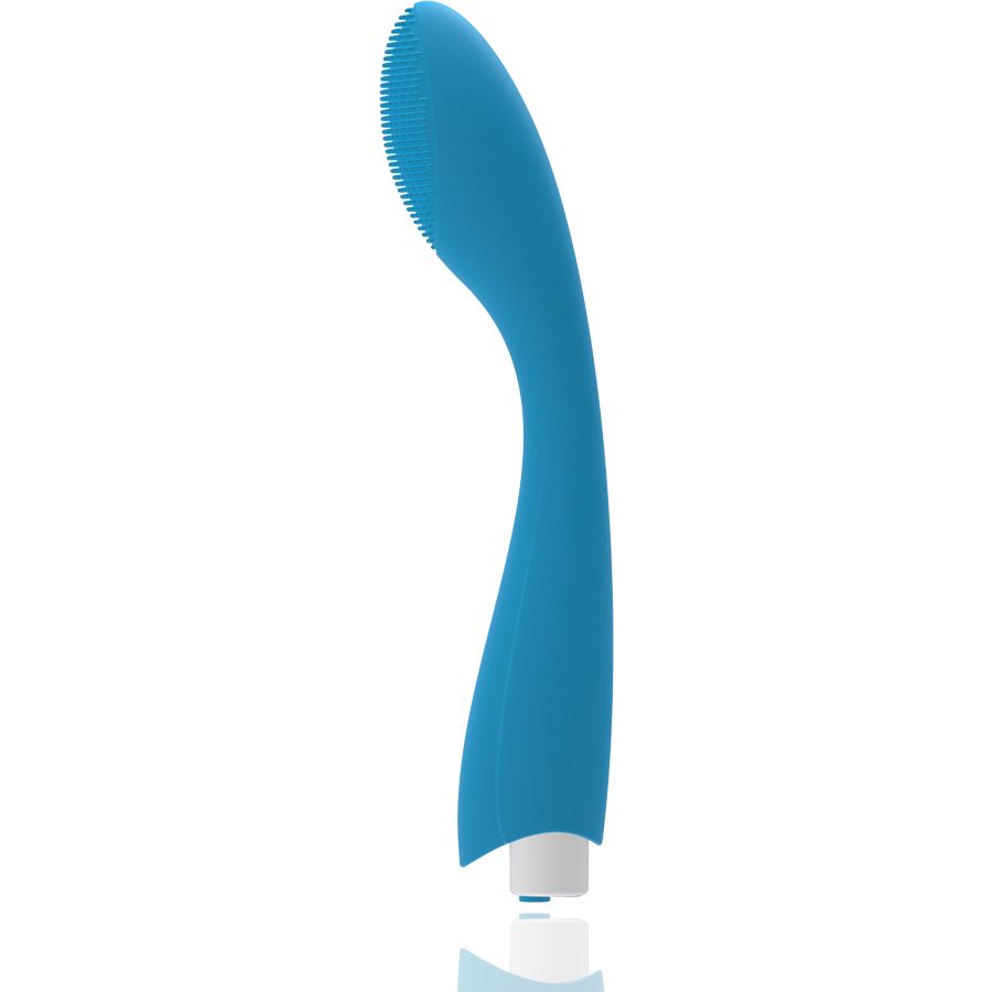 Blauer Vibrator mit ovalem Kopf und geriffelter Oberfläche. Weißer Sockel. Seitenansicht.
