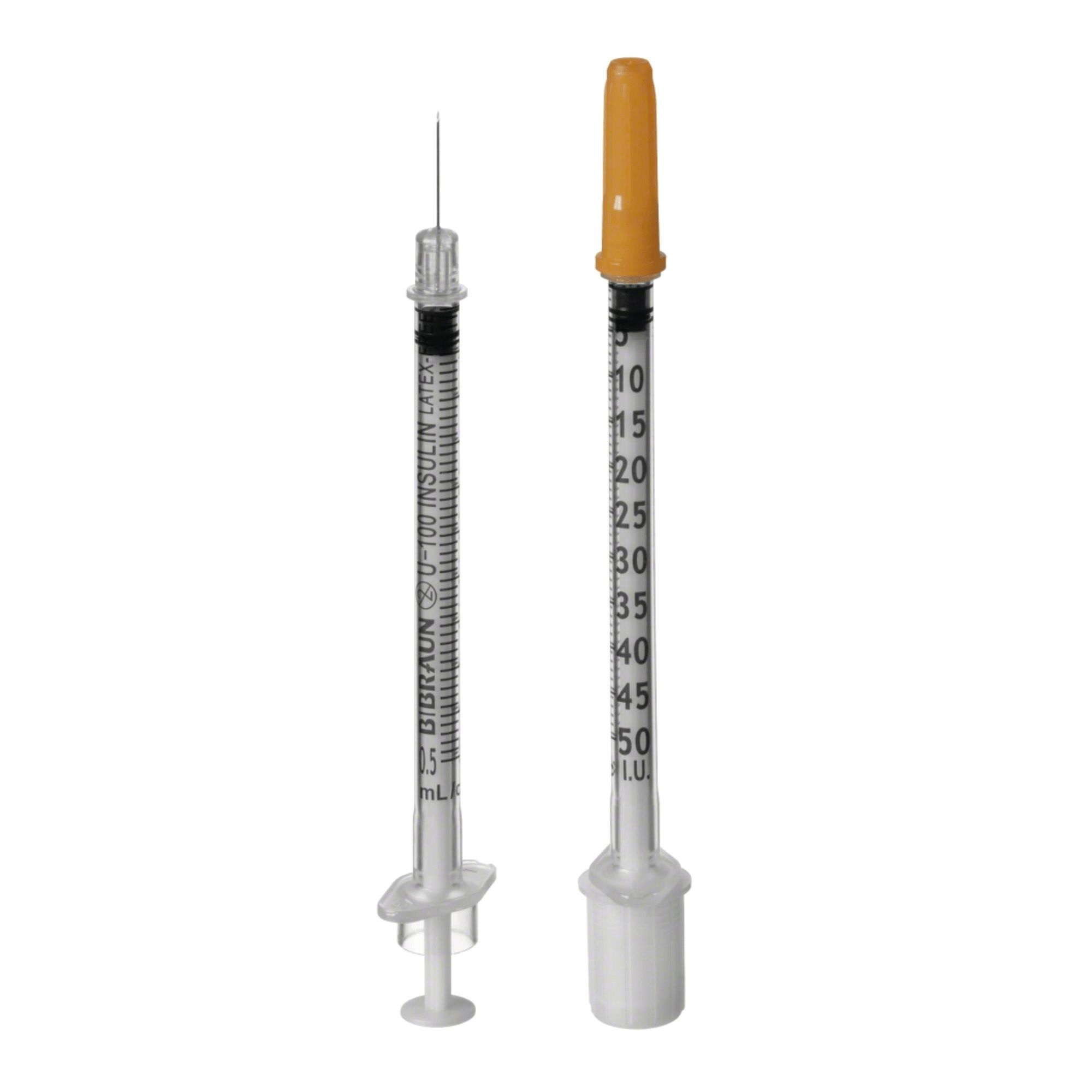 Zwei Insulinspritzen. Eine mit Nadel, die andere mit gelber Schutzkappe. Skala bis 50 IU. Aufschrift: B. Braun U-100 INSULIN LATEX.