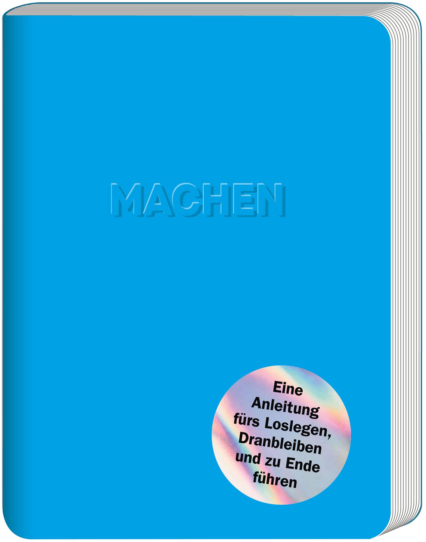 Blaues Buch mit geprägtem Schriftzug "MACHEN". Aufkleber mit Text: "Eine Anleitung fürs Loslegen, Dranbleiben und zu Ende führen".