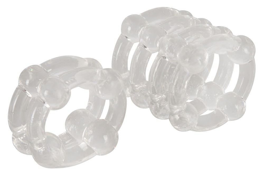 Zwei transparente Ringe mit kugelförmigen Elementen. Die Ringe sind nebeneinander angeordnet.