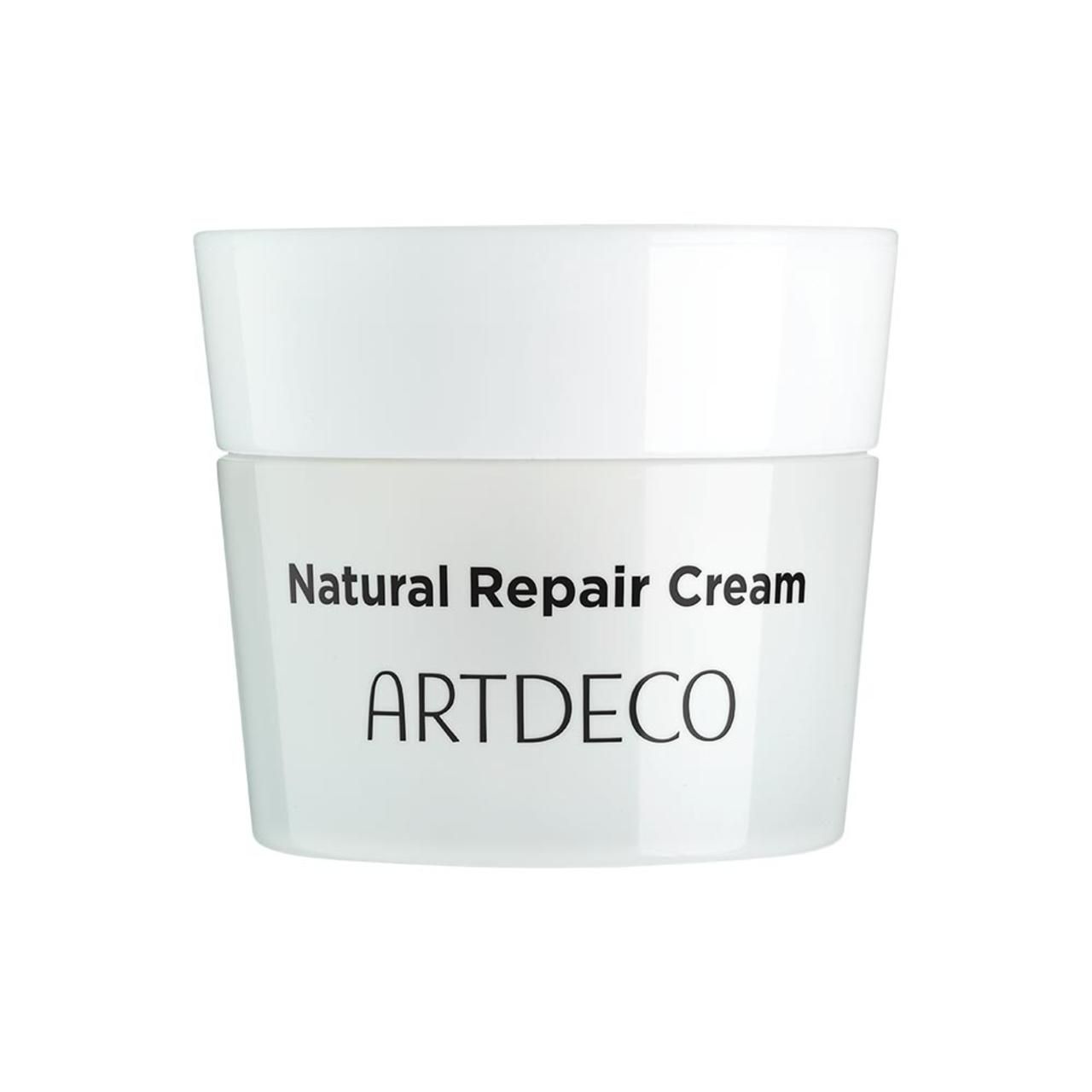 Weißer Tiegel mit Deckel. Aufschrift: Natural Repair Cream, ARTDECO. Produktverpackung.