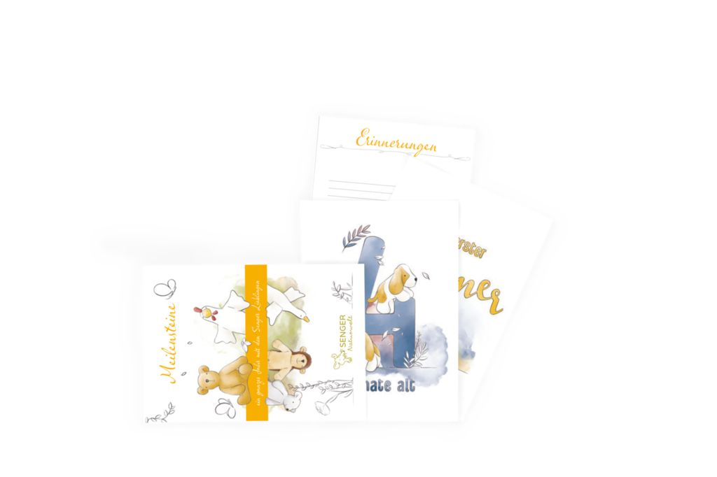 Karten-Set mit Illustrationen und goldfarbenem Schriftzug. Karten mit Illustrationen von Teddybär, Engel und Hund. Gelbes Band.