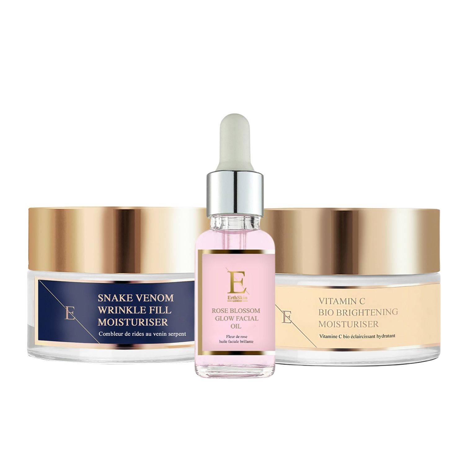 Set mit Creme- und Serum-Behältern. Goldfarbene Deckel, blaue und beige Etiketten. Markenname sichtbar.