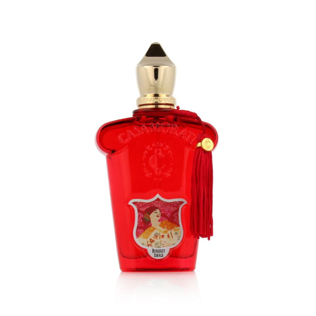 Roter Flakon mit goldfarbenem Verschluss und Quaste. Aufkleber mit floralem Motiv und Schriftzug.